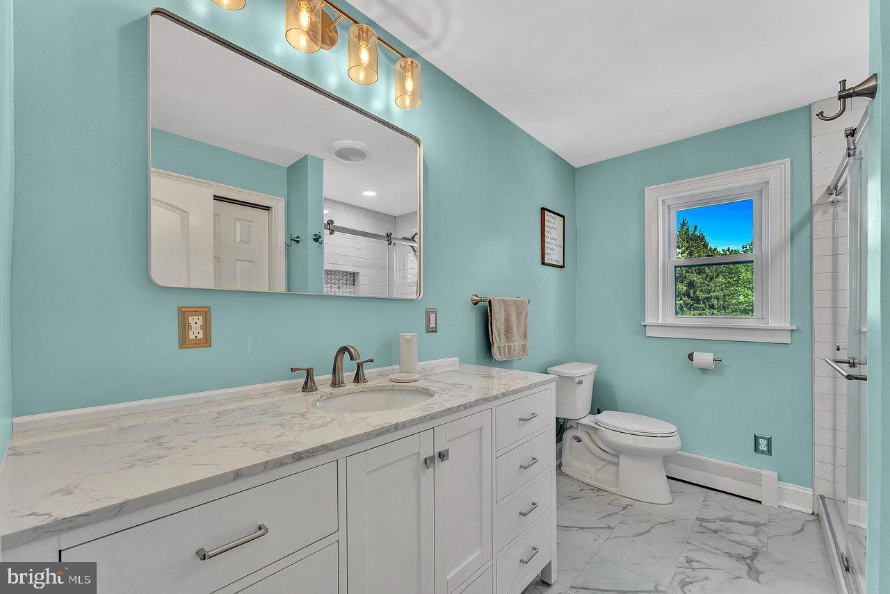 254 Friendship Road Cranbury, NJ 08512 - Photo 18 of 44 a bathroom with a toilet sink and mirror