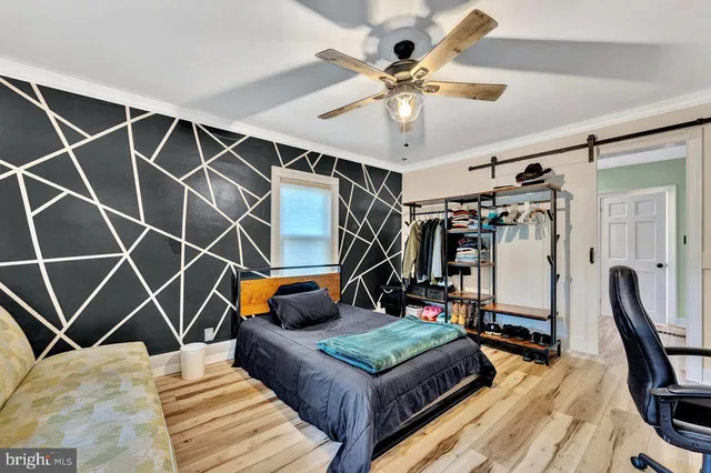 a living room with lots of furniture and gym equipment