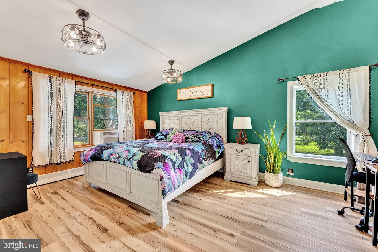 254 Friendship Road Cranbury, NJ 08512 - Photo 22 of 44 a bedroom with a bed and a large window