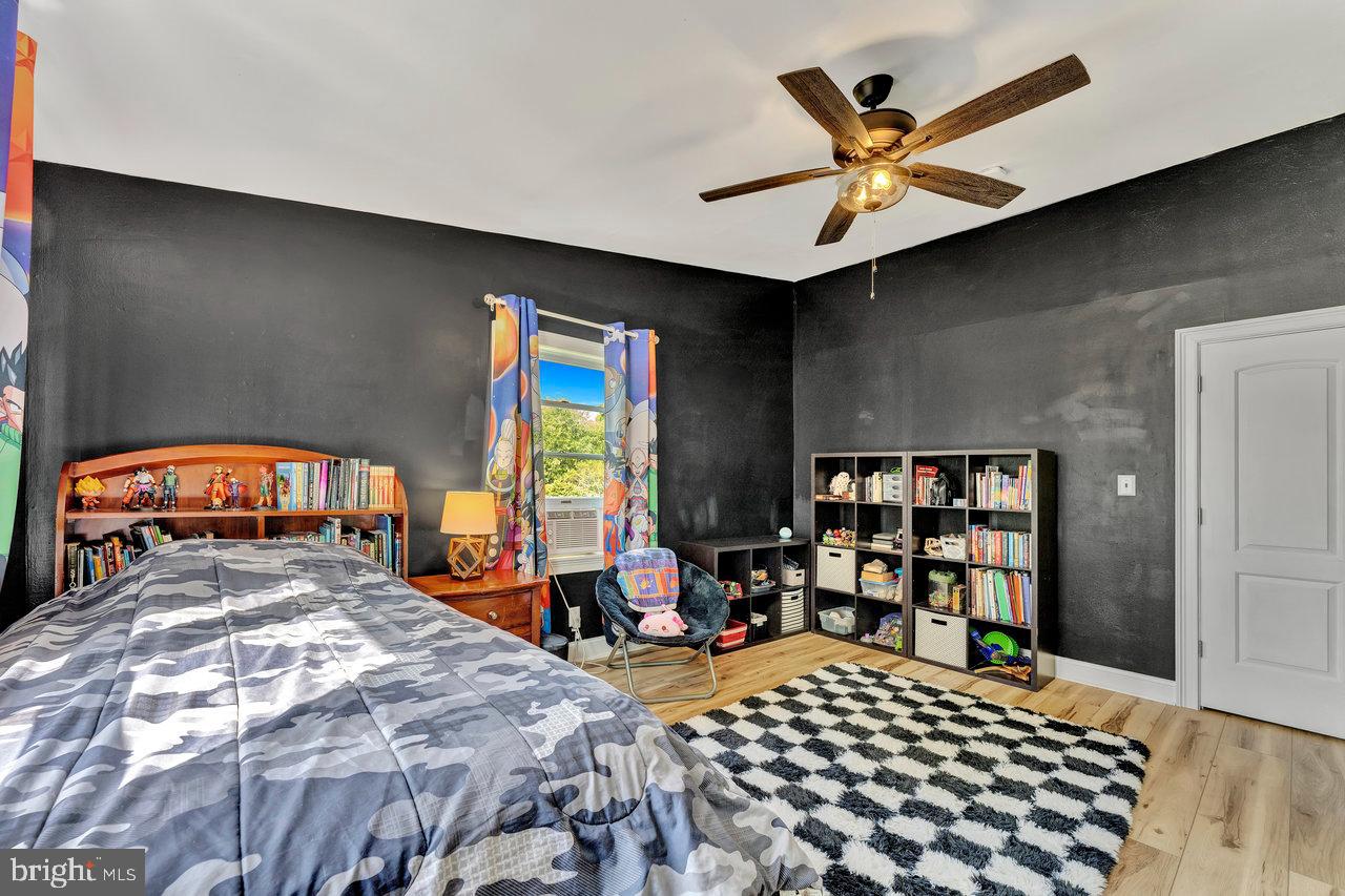 254 Friendship Road Cranbury, NJ 08512 - Photo 26 of 44 a bedroom with a bed and a large window