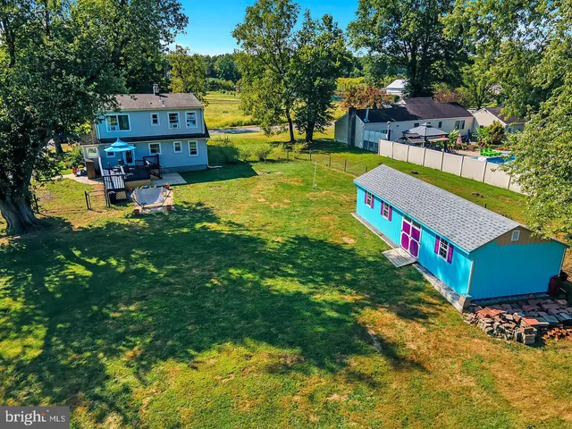 a small pool with lawn chairs