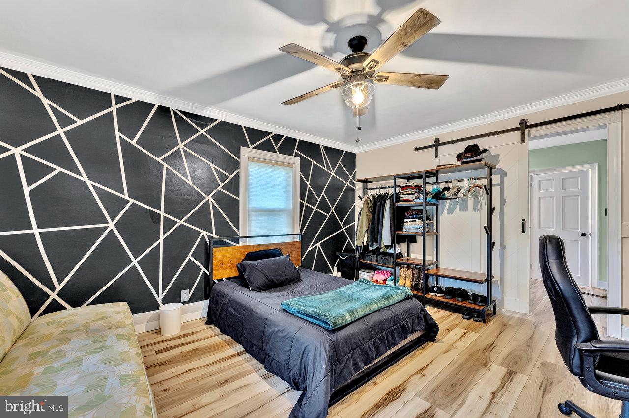 254 Friendship Road Cranbury, NJ 08512 - Photo 28 of 44 a bedroom with furniture and a gym equipment