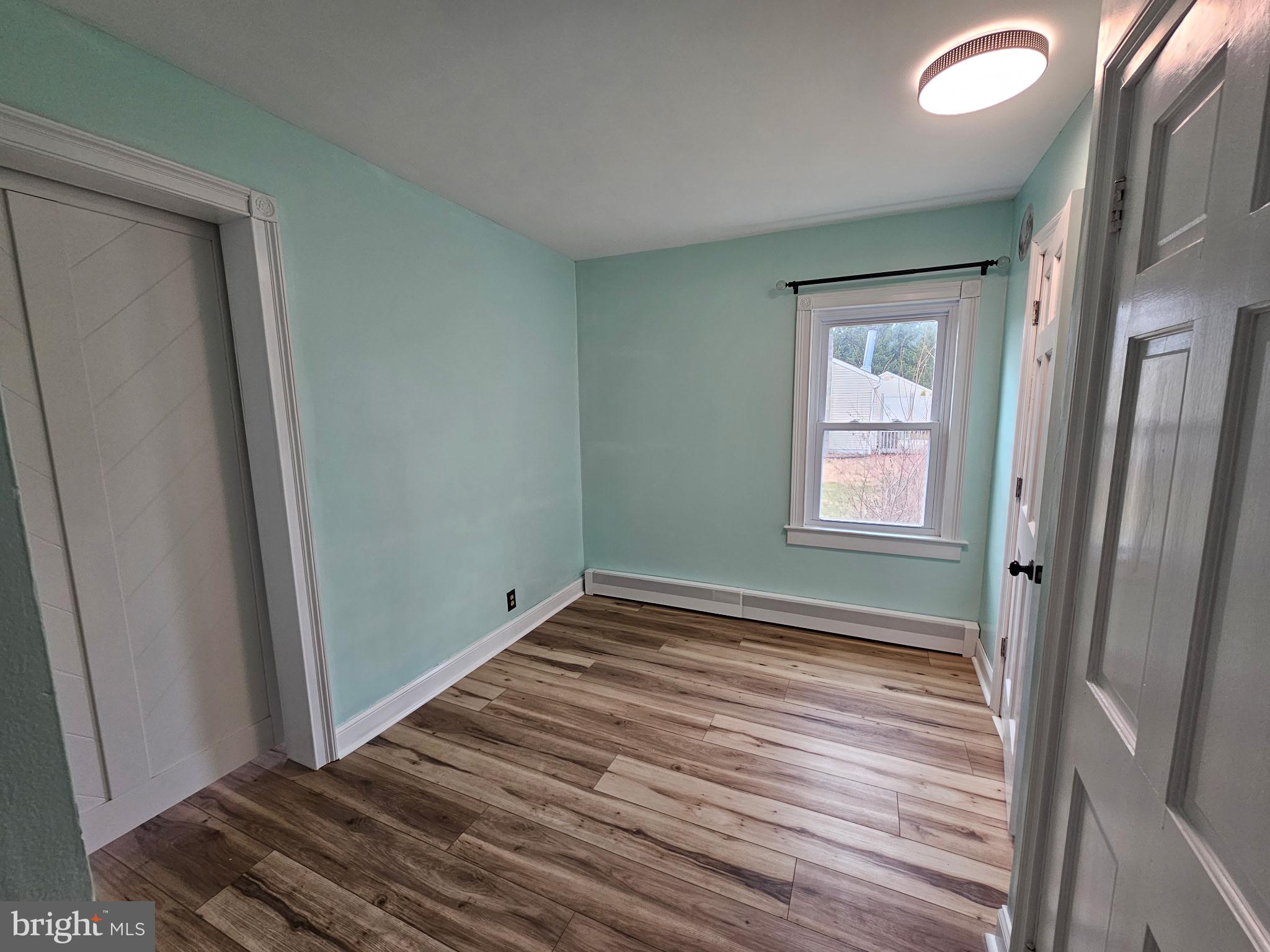 254 Friendship Road Cranbury, NJ 08512 - Photo 29 of 44 a view of a room with wooden floor and window