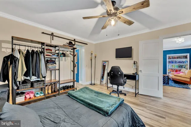 a bed room with a bed and a chair