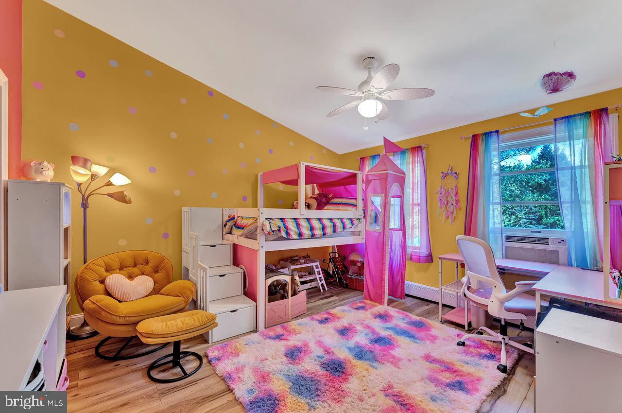 254 Friendship Road Cranbury, NJ 08512 - Photo 30 of 44 a bed room with a bed and a chair