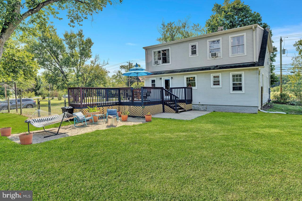 254 Friendship Road Cranbury, NJ 08512 - Photo 43 of 44 a view of a house with a yard porch and sitting area
