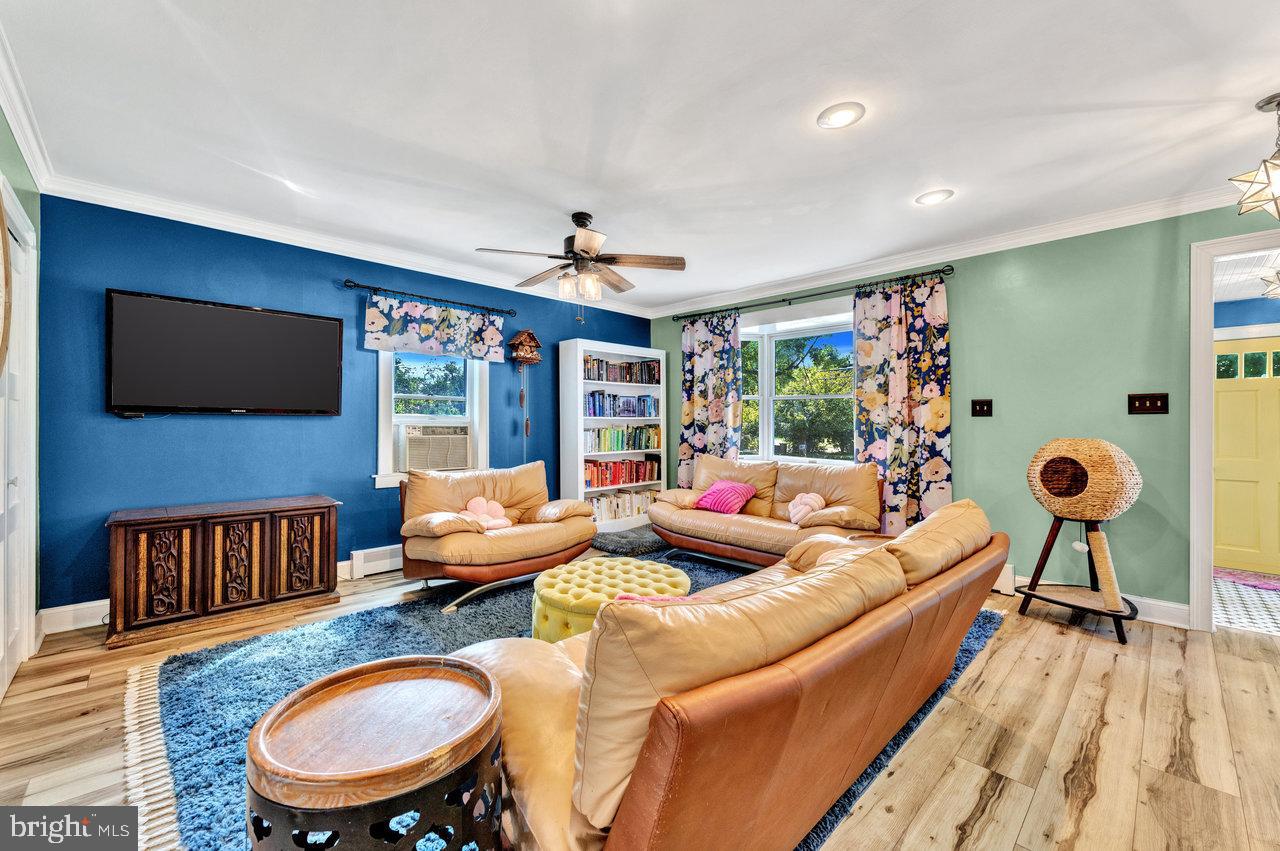 254 Friendship Road Cranbury, NJ 08512 - Photo 10 of 44 a living room with furniture and a flat screen tv