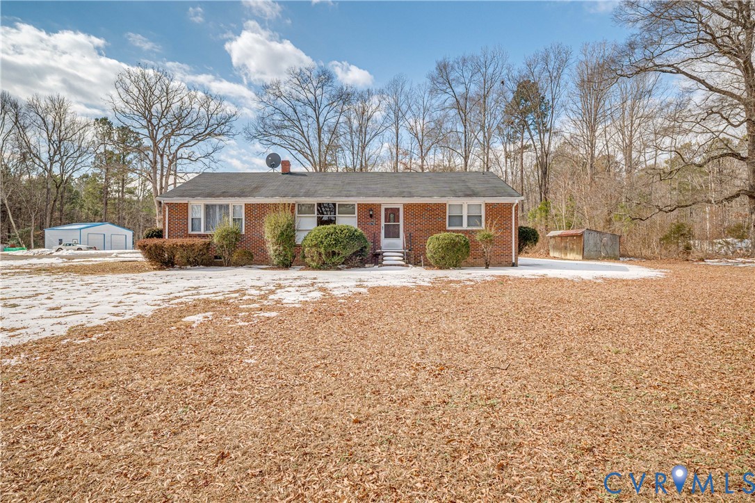 26746 Oxford Road Ruther Glen, VA 22546 - Photo 1 of 25 a front view of house with yard and trees around
