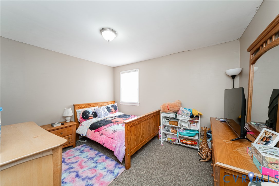 26746 Oxford Road Ruther Glen, VA 22546 - Photo 15 of 25 a bedroom with a bed and a flat screen tv
