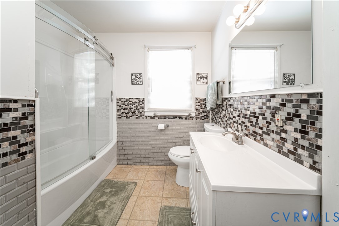 26746 Oxford Road Ruther Glen, VA 22546 - Photo 19 of 25 a bathroom with a sink a toilet and shower
