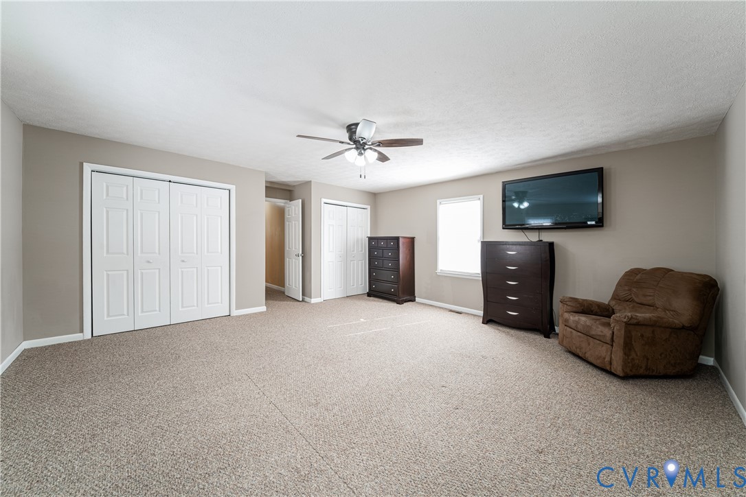 26746 Oxford Road Ruther Glen, VA 22546 - Photo 22 of 25 a living room with furniture and a flat screen tv