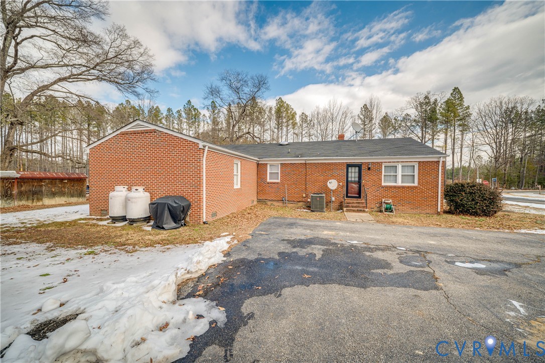 26746 Oxford Road Ruther Glen, VA 22546 - Photo 25 of 25 a view of a house with a snow in the yard