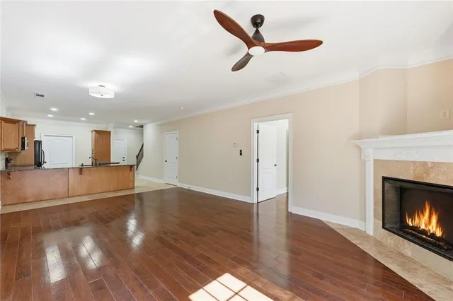 a kitchen with stainless steel appliances kitchen island granite countertop a stove a sink and a microwave