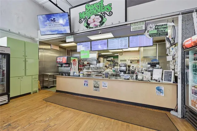 a view of a patio with table and chairs and potted plants