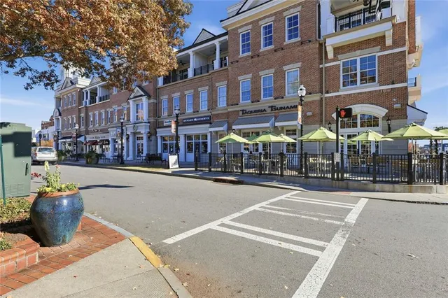 a room with lots of wooden furniture and a chandelier
