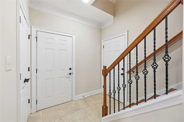 a view of a kitchen with kitchen island stainless steel appliances refrigerator stove microwave and cabinets