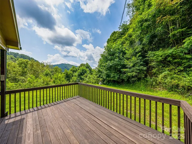 a view of balcony with furniture