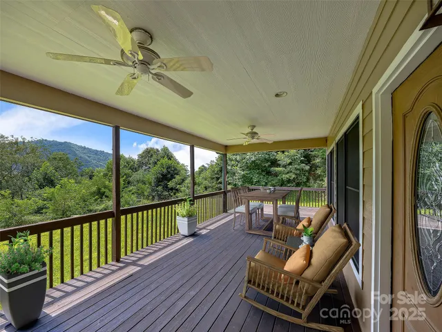 a view of a porch with wooden floor and stairs
