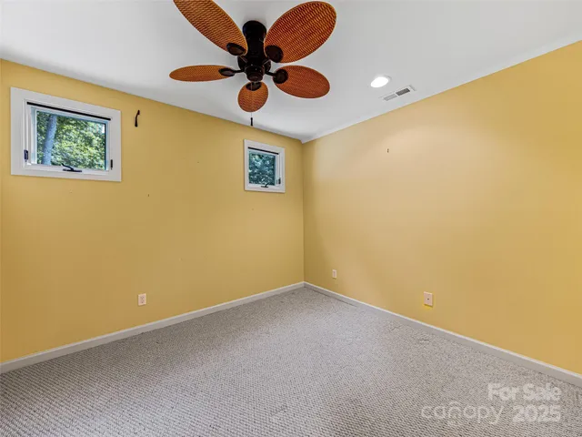 a view of a house with a yard and deck
