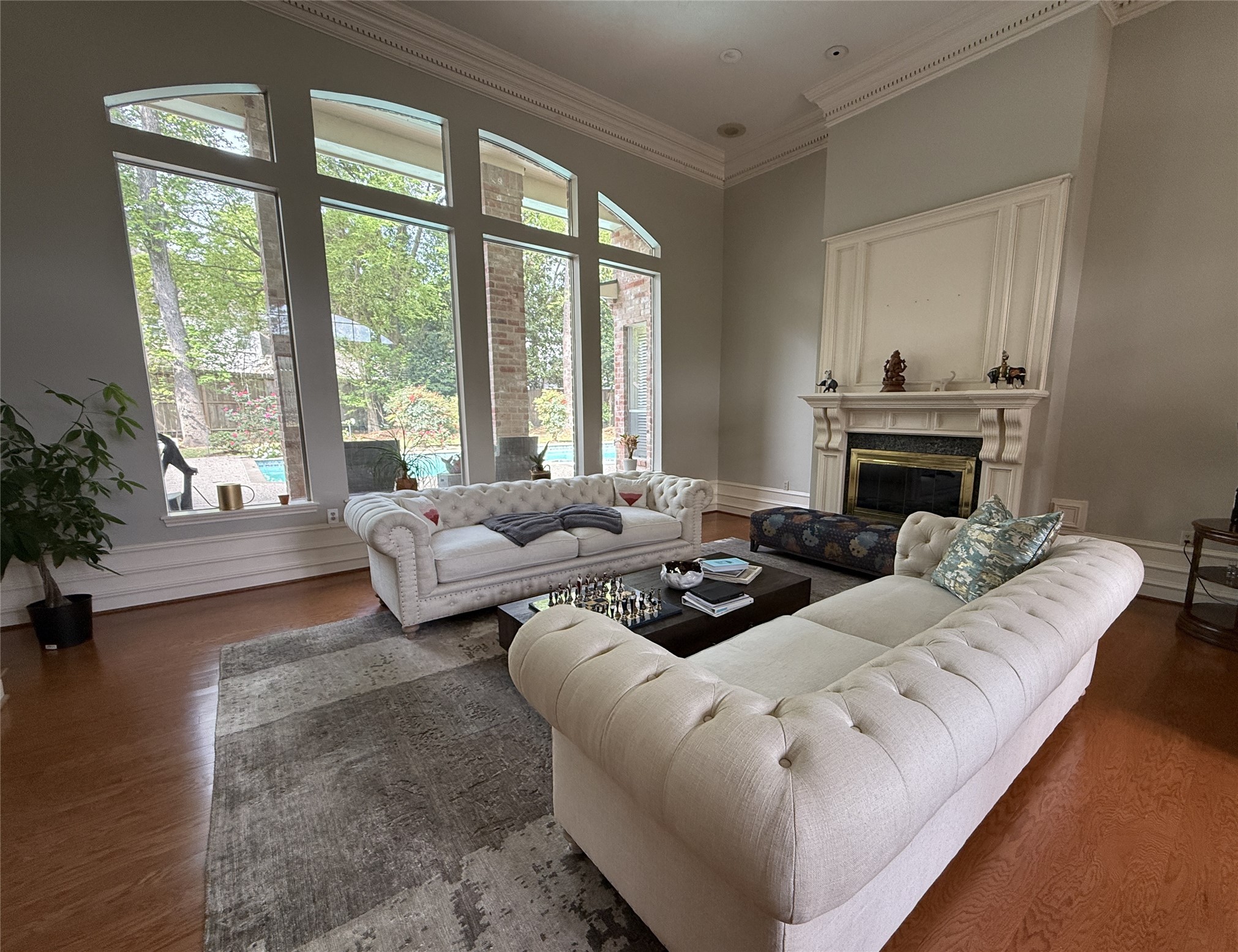 15923 Harwick Drive Spring, TX 77379 - Photo 2 of 16 This is the striking formal living room with gas log fireplace and views of the back yard.