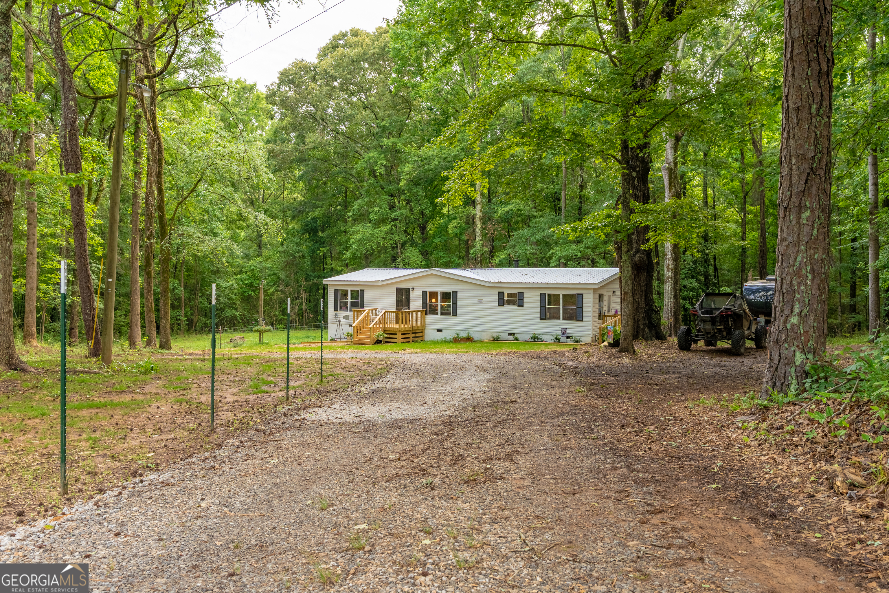 452 Aikenton Road Monticello, GA 31064 - Photo 41 of 47 a view of a house with a backyard