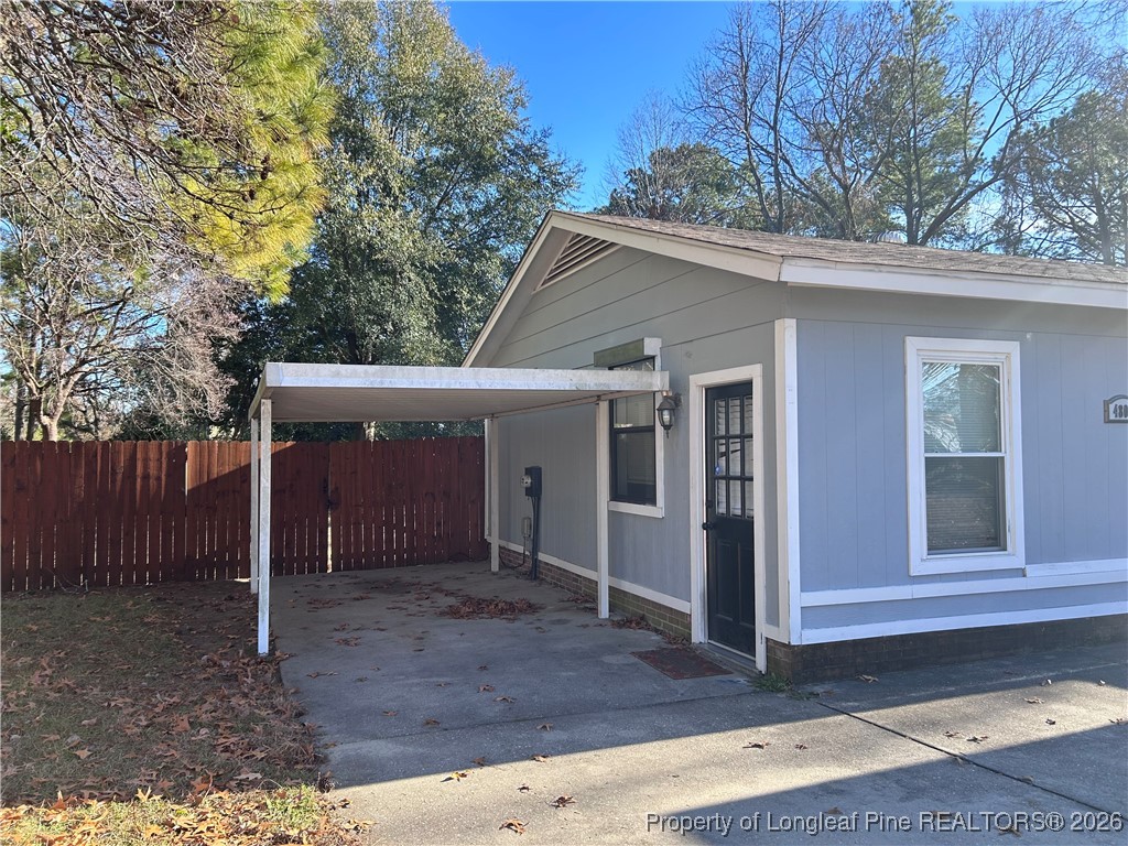 4805 Old Field Road Fayetteville, NC 28304 - Photo 3 of 5 a view of a house with a door and wooden fence