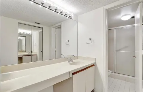 a bathroom with a sink double vanity and a mirror
