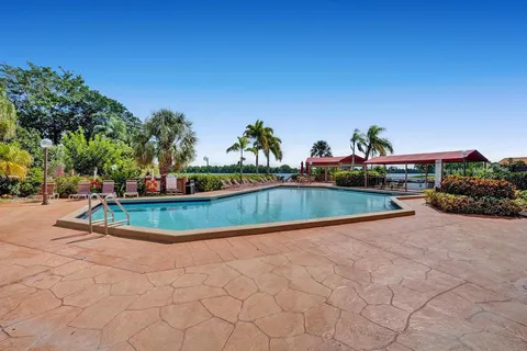 a view of a swimming pool with a yard