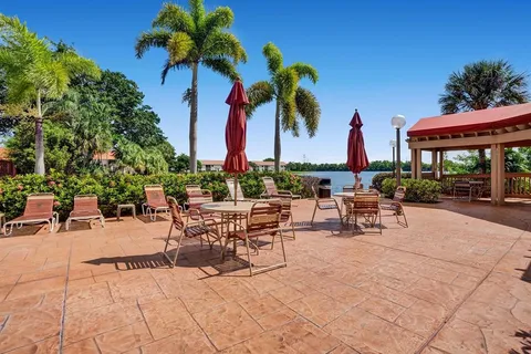 a view of a patio with a table and chairs