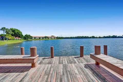 a deck view with a lake view