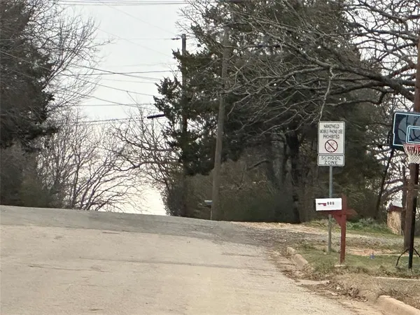 a sign board with yard