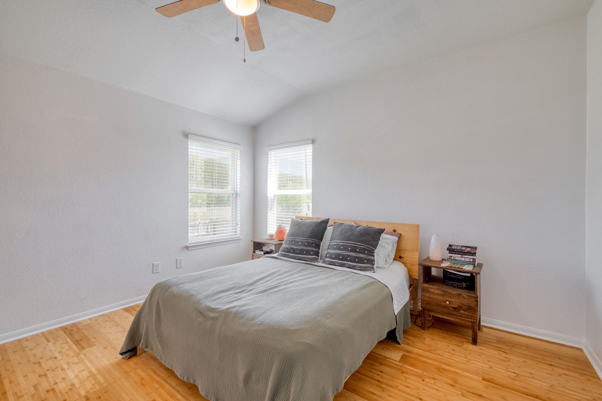 174 Falcon Drive Luling, TX 78648 - Photo 15 of 38 Bedroom with light wood-style floors, lofted ceiling, and ceiling fan