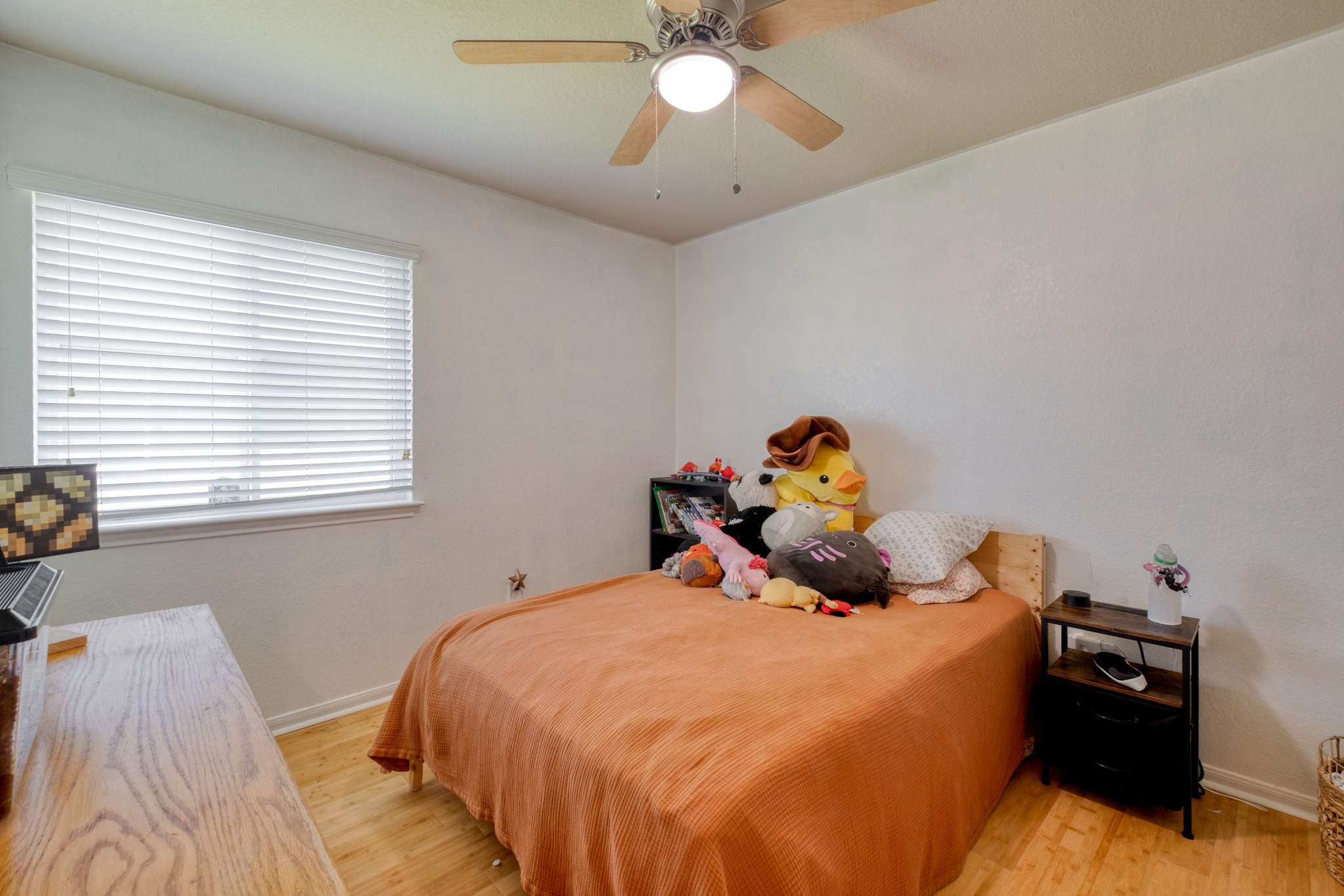 174 Falcon Drive Luling, TX 78648 - Photo 18 of 38 Bedroom with ceiling fan and light wood-type flooring