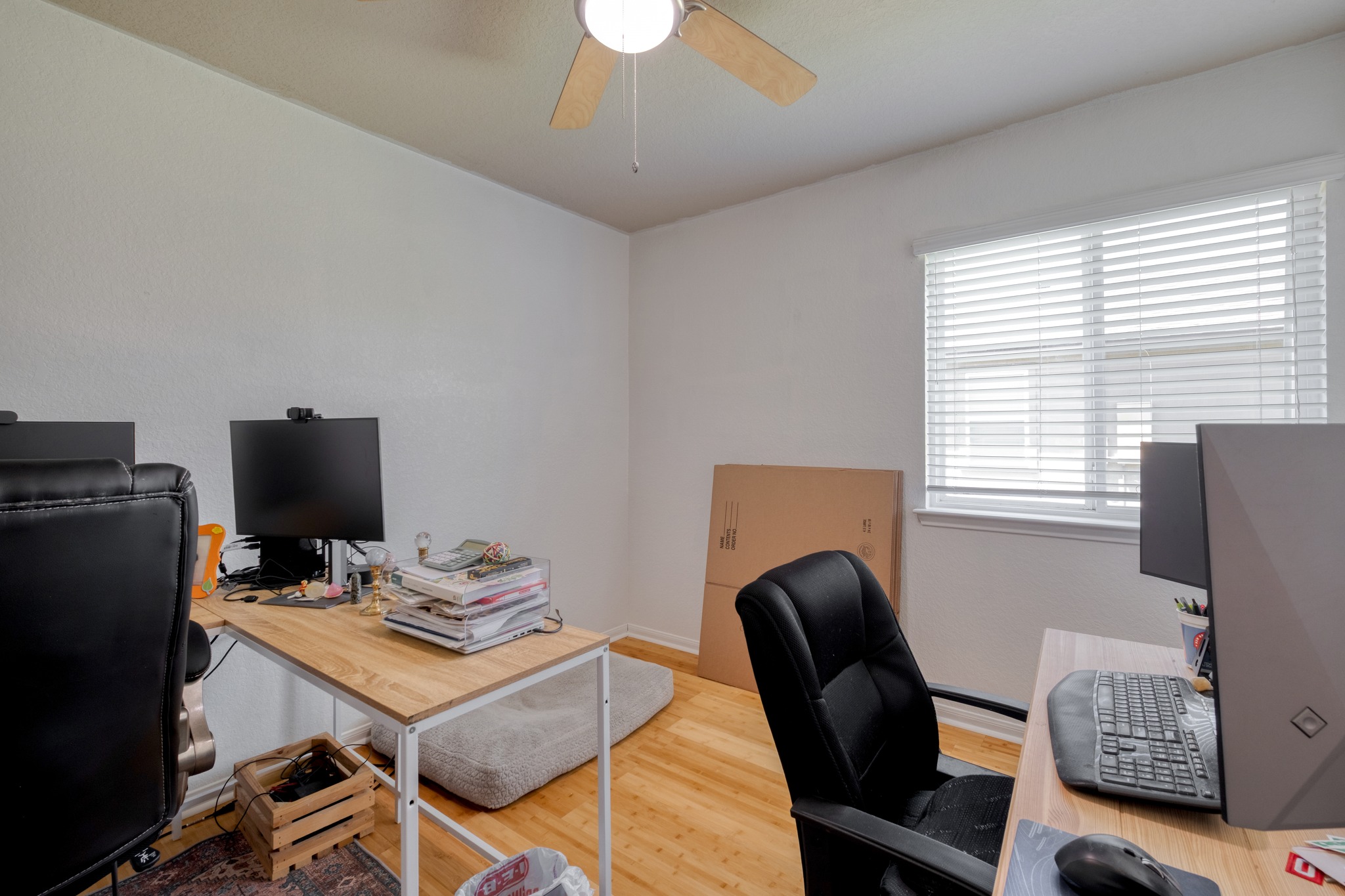174 Falcon Drive Luling, TX 78648 - Photo 19 of 38 3rd bedroom being used as Home office featuring light wood-style flooring and a ceiling fan