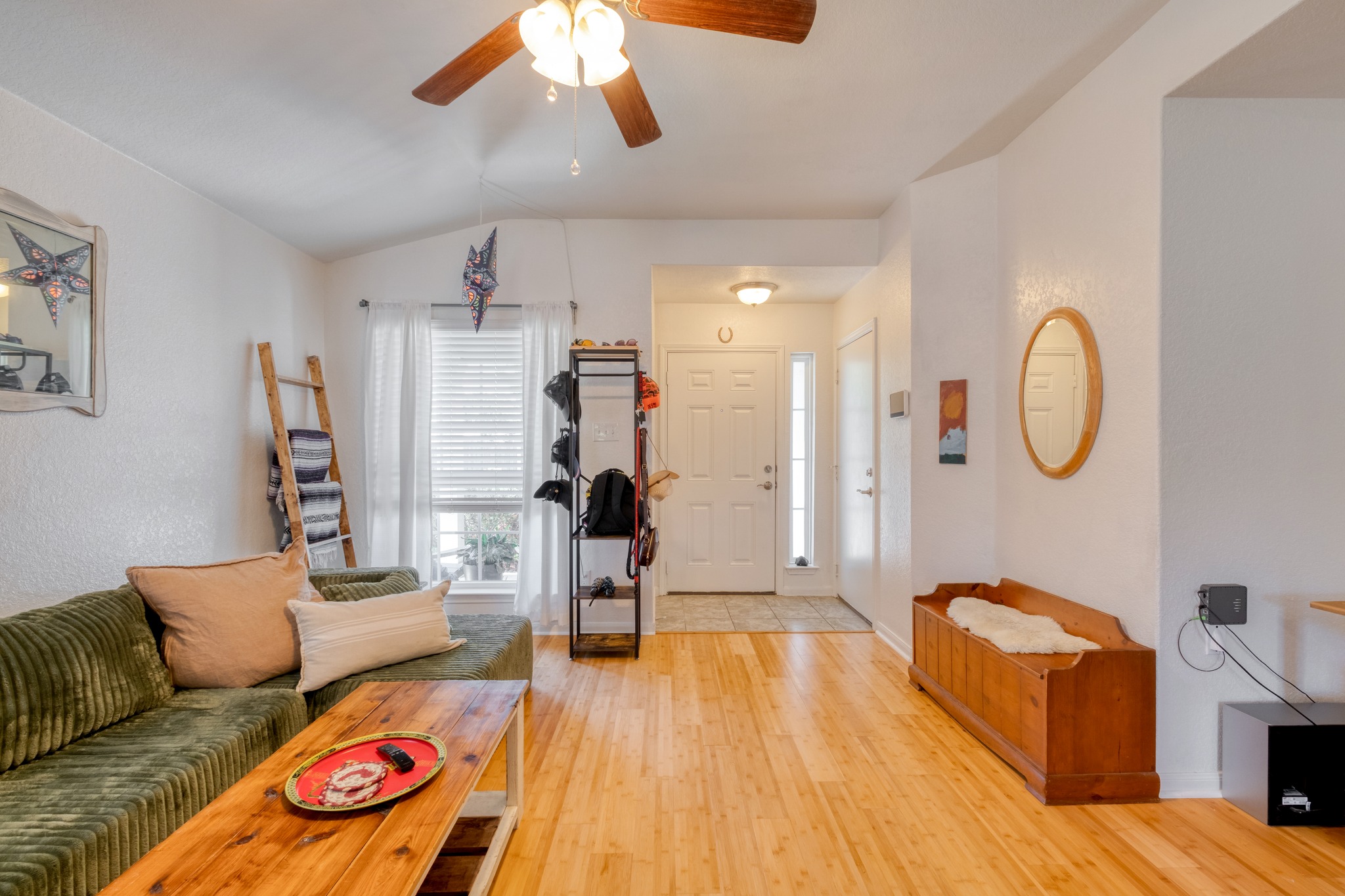 174 Falcon Drive Luling, TX 78648 - Photo 6 of 38 Living room with a ceiling fan, light wood-style flooring, and vaulted ceiling
