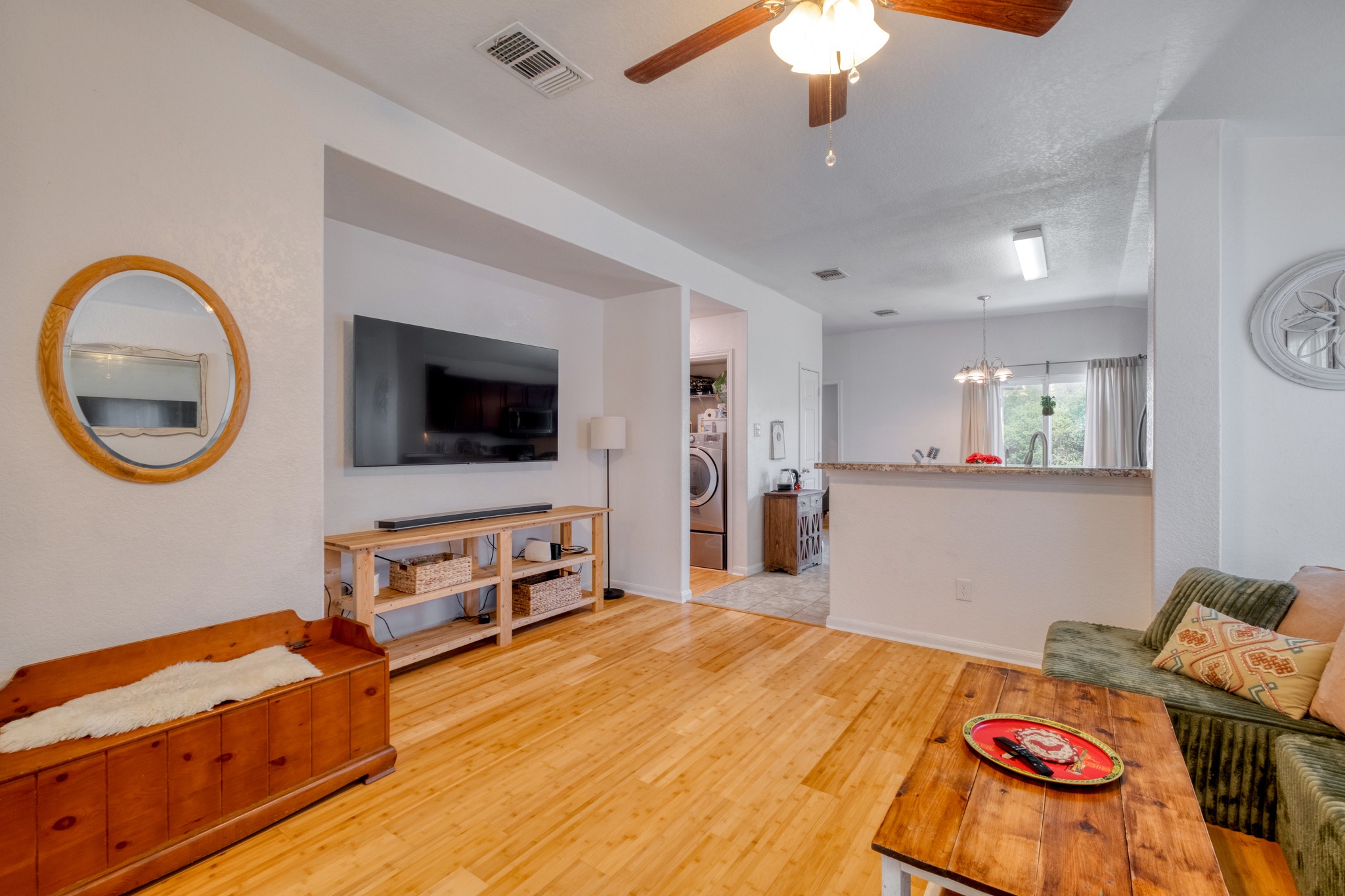 174 Falcon Drive Luling, TX 78648 - Photo 8 of 38 Living area featuring a ceiling fan, light wood-type flooring