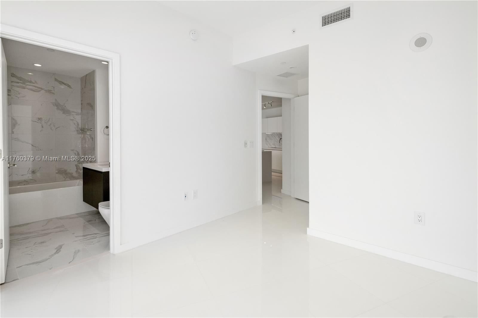 851 Northeast 1st Avenue, Unit 4203 Miami, FL 33132 - Photo 12 of 34 a view of a room with a hallway