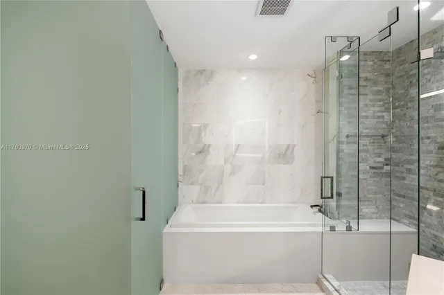 a bathroom with a toilet sink and shower