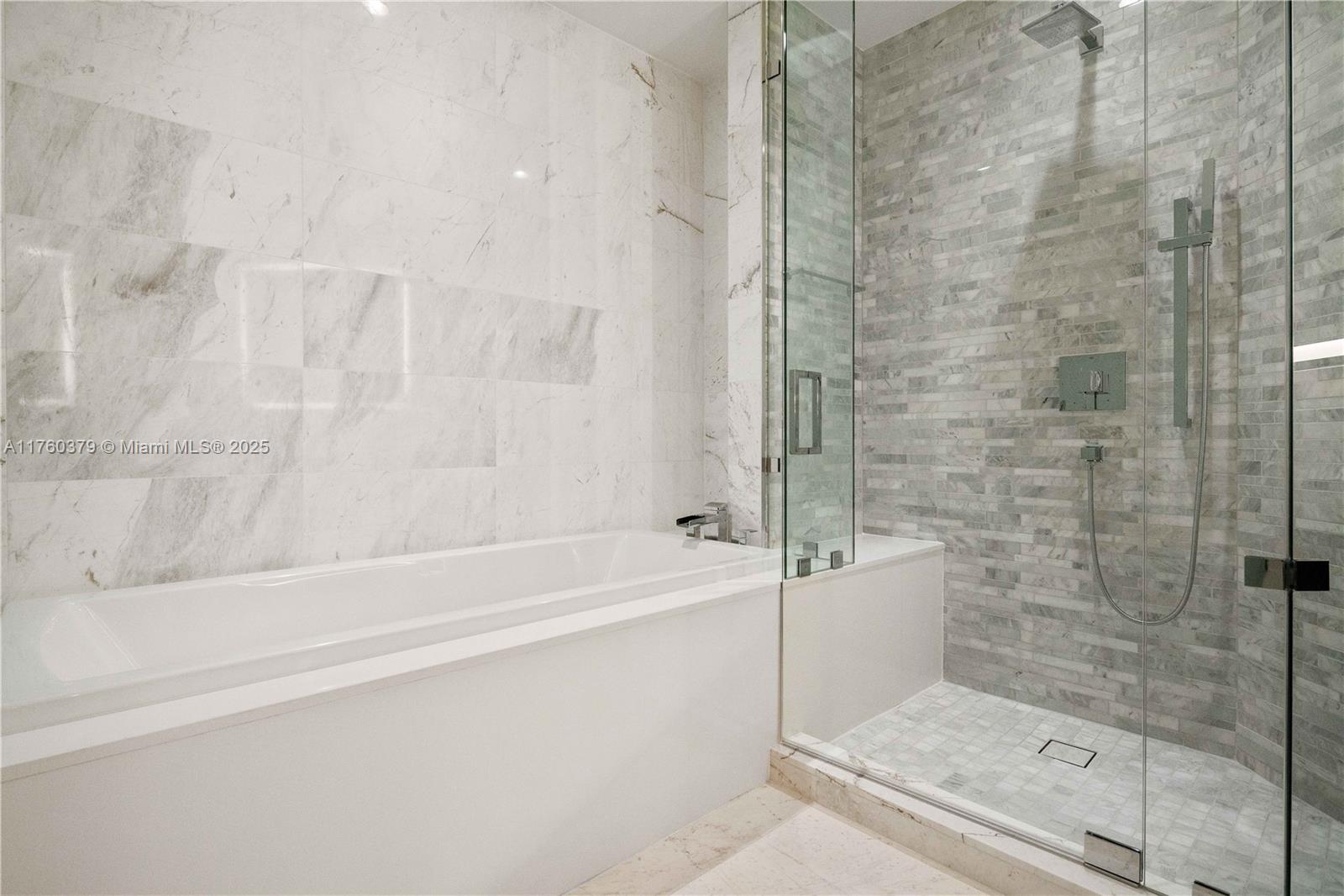 851 Northeast 1st Avenue, Unit 4203 Miami, FL 33132 - Photo 25 of 34 a bathroom with a bathtub and a shower