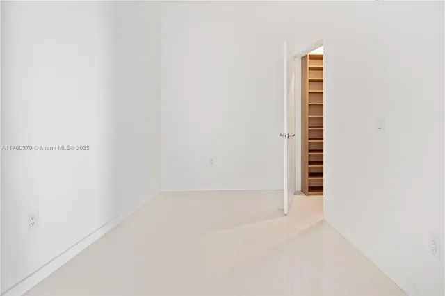 a view of a walk in closet and window