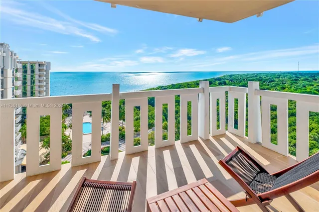 a view of wooden balcony with furniture