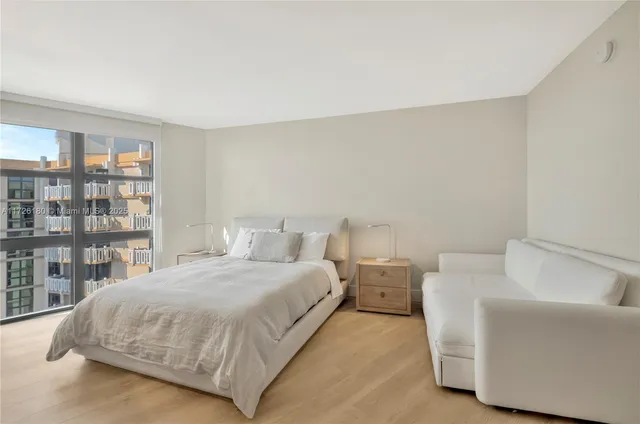 a bedroom with a bed and a couch