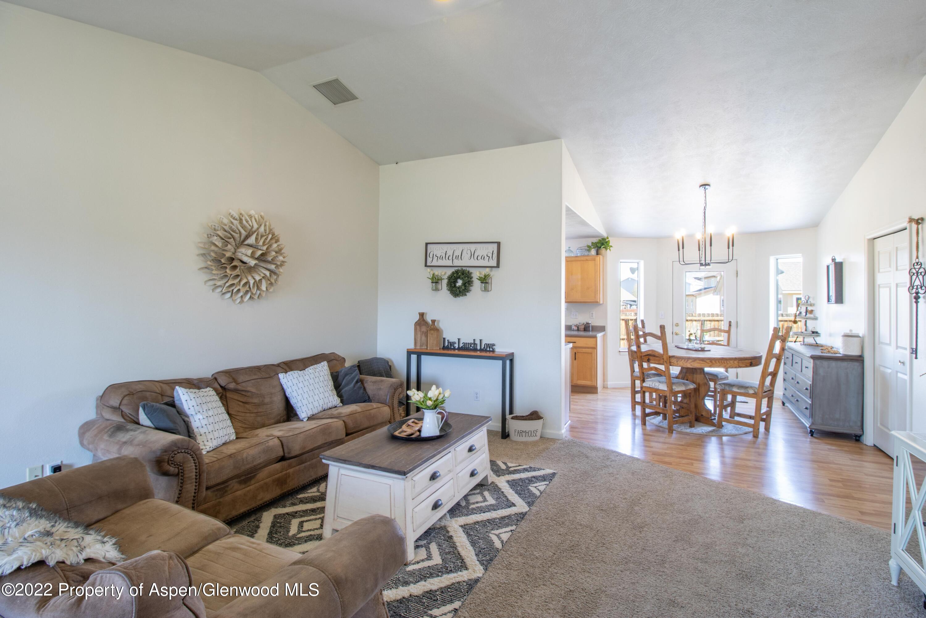 1575 Balsam Court Rifle, CO 81650 - Photo 1 of 14 a living room with furniture and wooden floor