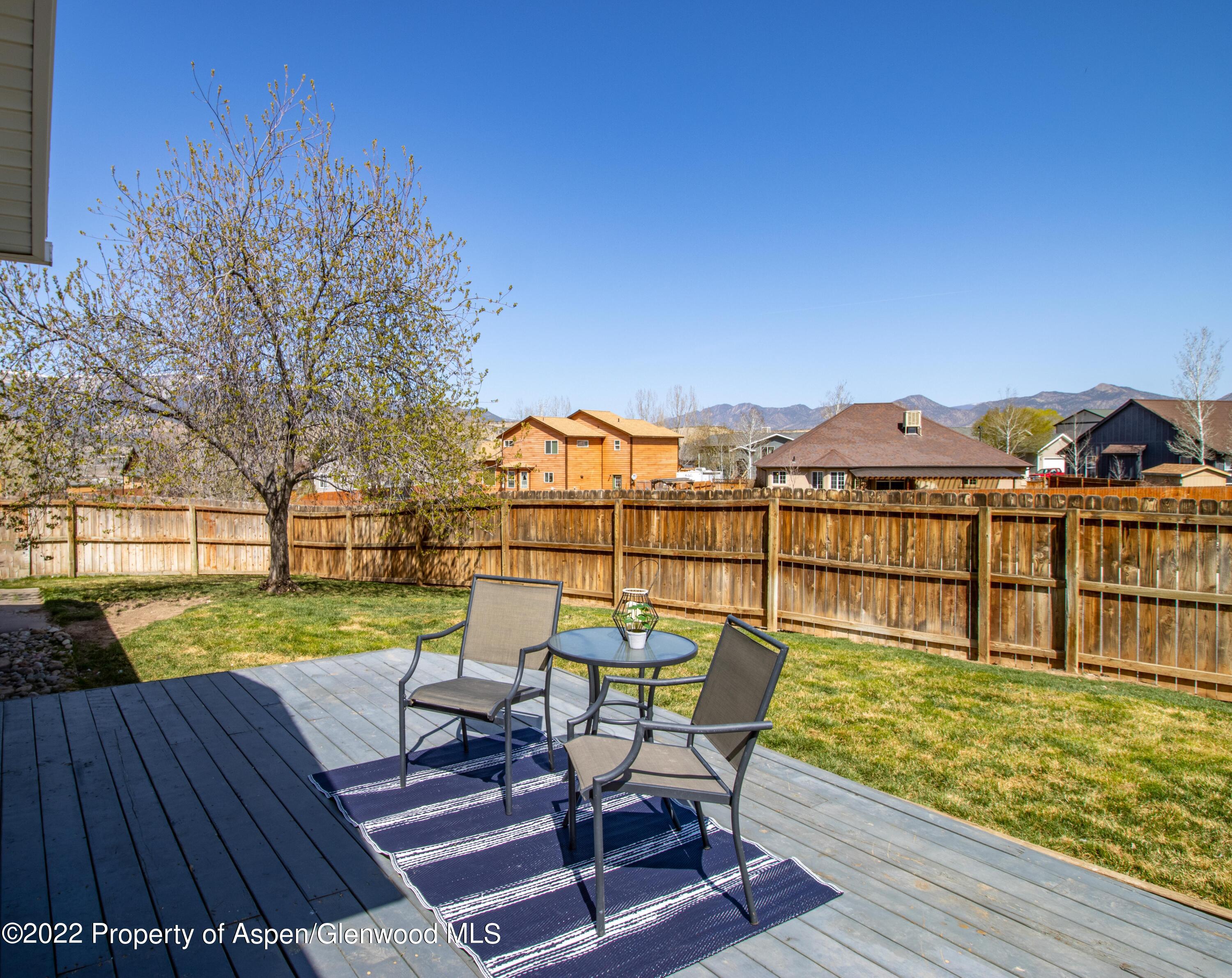 1575 Balsam Court Rifle, CO 81650 - Photo 12 of 14 a view of a chair and table on the wooden deck