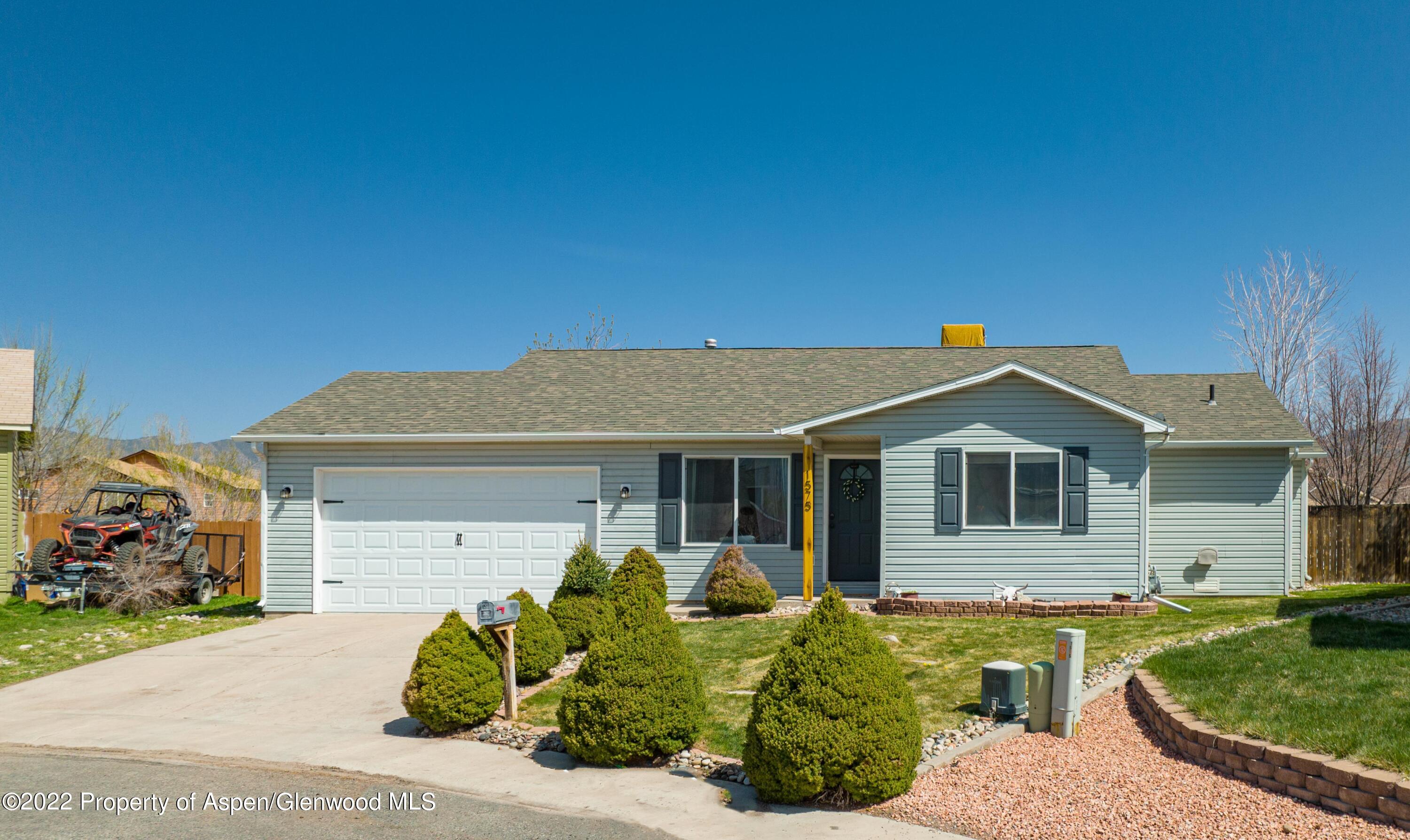 1575 Balsam Court Rifle, CO 81650 - Photo 2 of 14 a front view of a house with garden