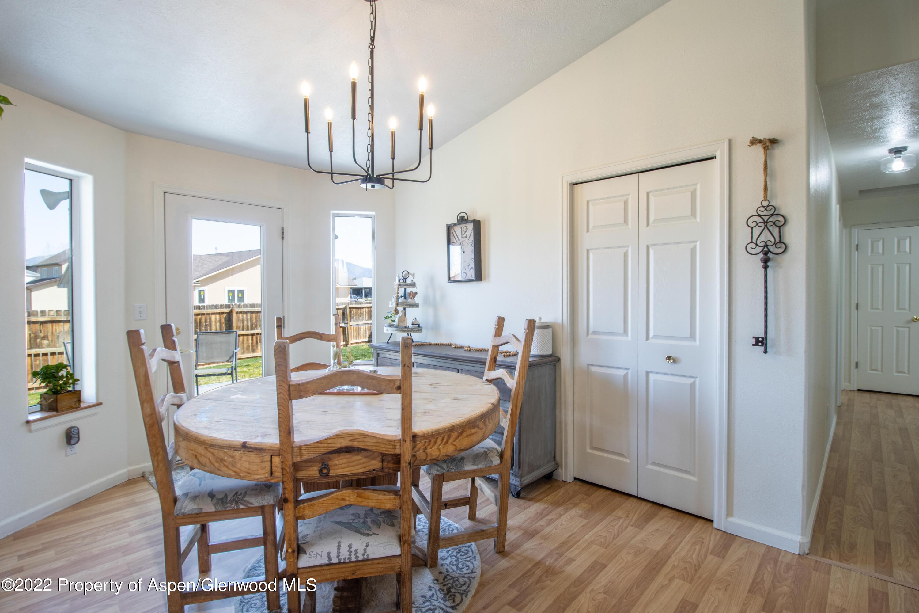 1575 Balsam Court Rifle, CO 81650 - Photo 4 of 14 a view of a dining room with furniture and wooden floor