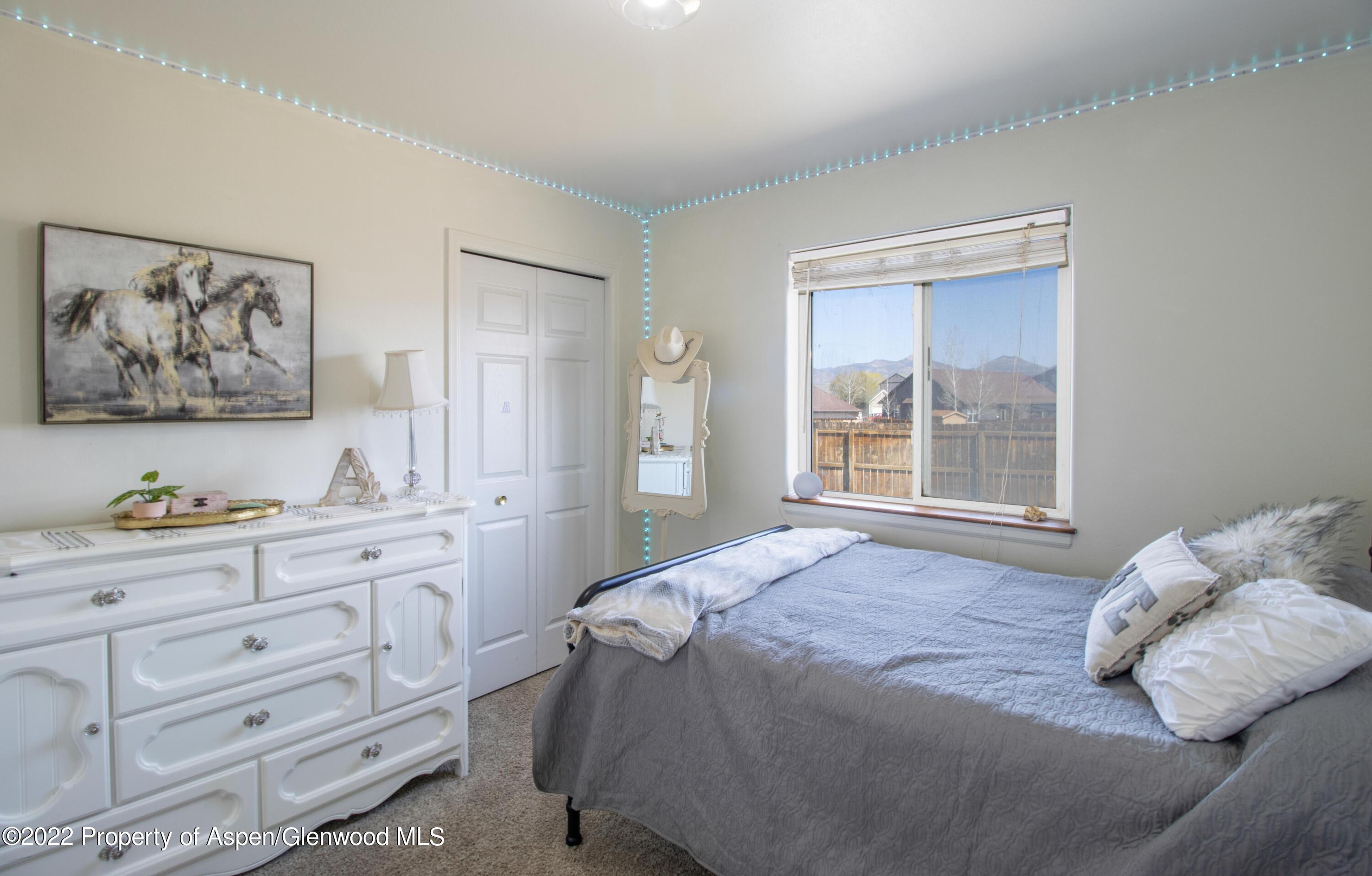 1575 Balsam Court Rifle, CO 81650 - Photo 8 of 14 a bedroom with a bed and a window