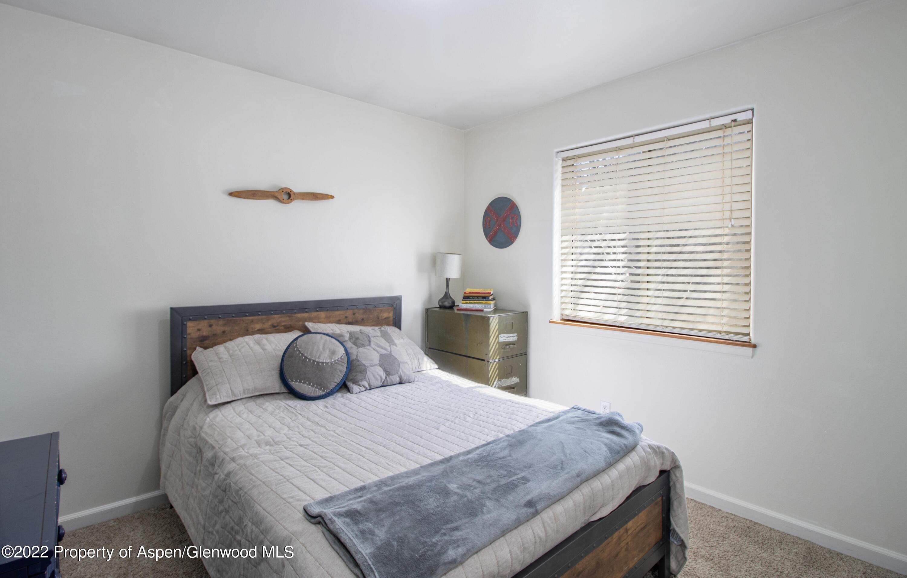 1575 Balsam Court Rifle, CO 81650 - Photo 10 of 14 a bedroom with a bed and window