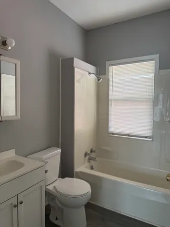 a bathroom with a sink toilet and bathtub