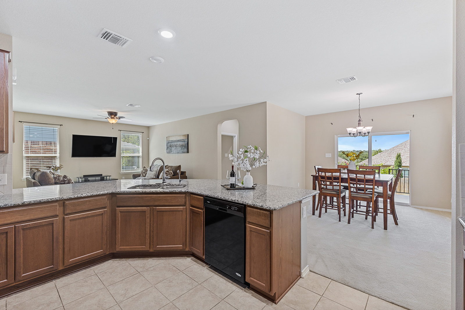 437 Sheepshank Drive Georgetown, TX 78633 - Photo 5 of 22 The open concept between the kitchen and living areas extends into the dining area.
